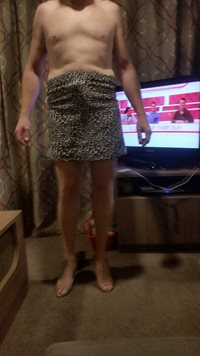 Hubby in his new shoes and skirt he looks excited