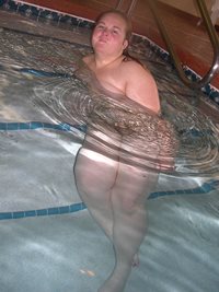 Naked in a motel pool