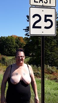 Side of busy road. Lots of people saw her tits.