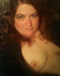 Sitting around the house with my tits out.