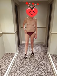 A little tease after a meal in our hotel corridor.    M was scared to be di...