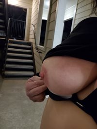 My wife flashing me her boob outside our apartment.