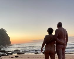 Nude on a public beach watching the sun rise