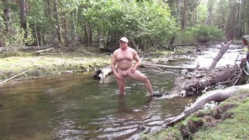 Naked and hard in the river.