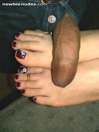 Here's another pic of my gf doing what she luvs best giving footjobs!!
