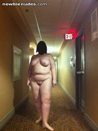 Naked in a hotel hall.  Getting real daring.