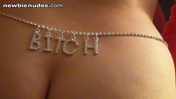 a sexy waist chain that reads BITCH  just above the middle of her ass she n...