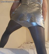 my sissy ass in silver hotpants, tight silver tights and a slutty silver sa...