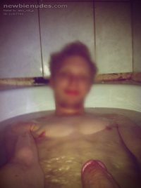 Lying in bath naked, horny and alone.