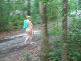 Vic taking a walk in the woods at nudist resort