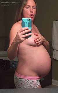 Posing pregnant.